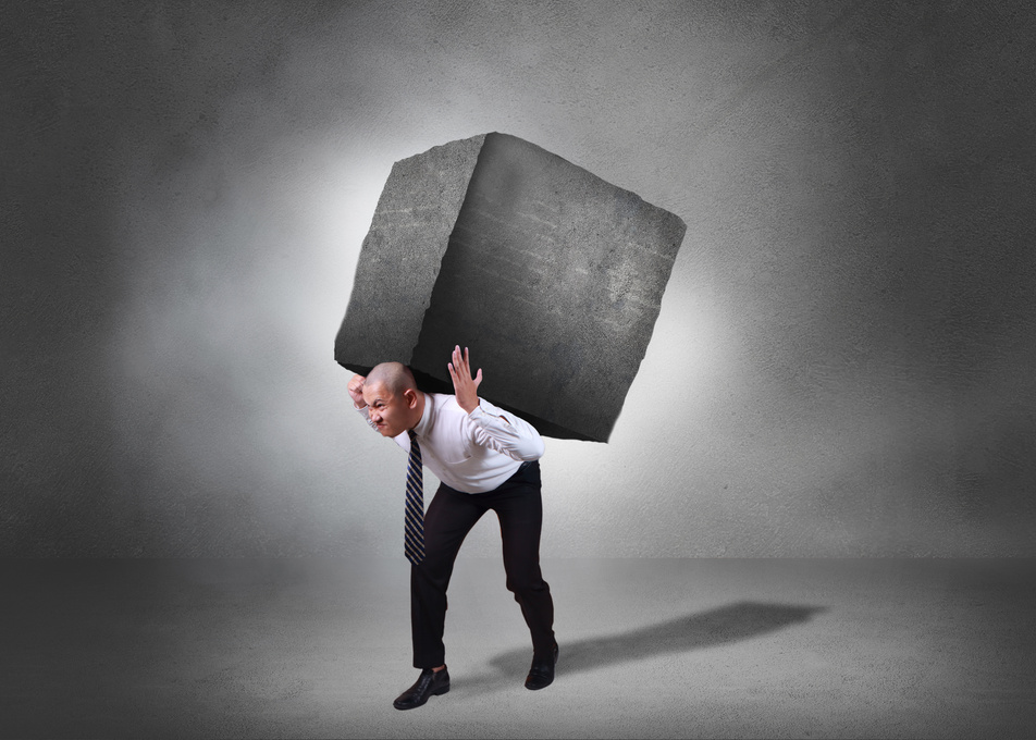 Businessman Carrying Heavy Stone